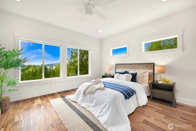 Main floor primary bedroom with view of the lake