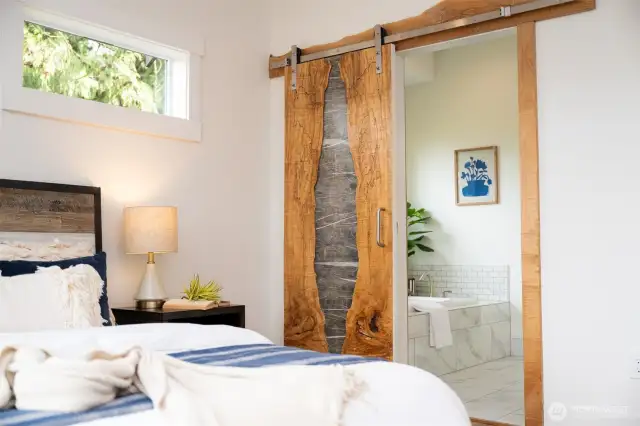 Custom slab door to primary bathroom