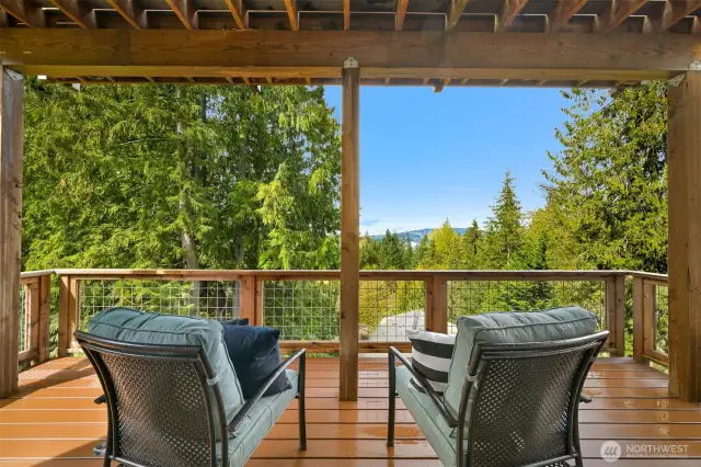 Covered deck on first lower level with view of the lake
