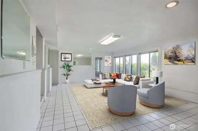 2nd seating area/ family room that can EASILY TURNED INTO A KITCHEN  to accompany the 1 bedroom and  2 bathrooms already downstairs.