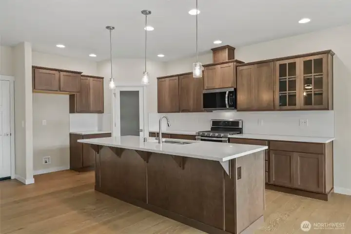 Home is under construction. Photos are of a previously built home from the same community with similar finishes. Builder reserves the right to change features, plans, prices & specifications without notice. Features vary by plan. Buyer to verify square footage.