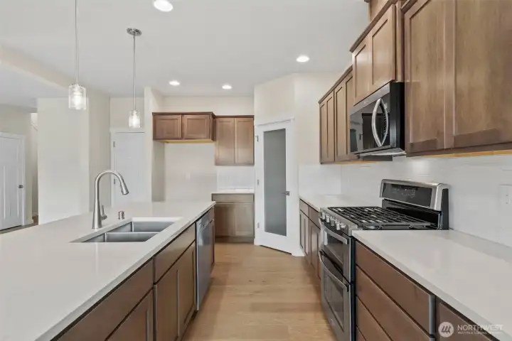 Home is under construction. Photos are of a previously built home from the same community with similar finishes. Builder reserves the right to change features, plans, prices & specifications without notice. Features vary by plan. Buyer to verify square footage.