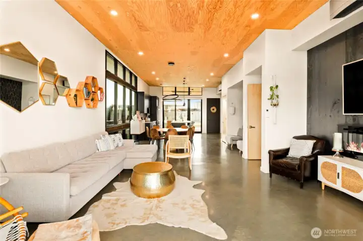 The living room is spacious and open. The concrete floors warm your feet and give such a modern living feeling