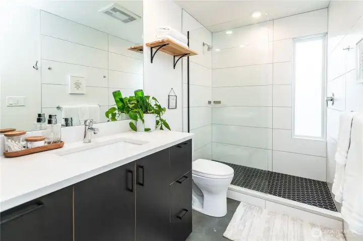 Large custom tiled shower for relaxing showers.