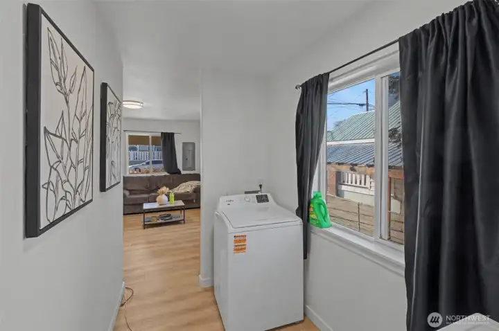 Unit A washer/Dryer area looking to living room