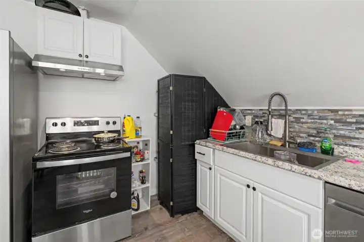 Unit C (hotwater tank behind screen)