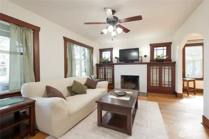 Large Living room with original hardwood trim brings warmth and cozy comfort to the space.