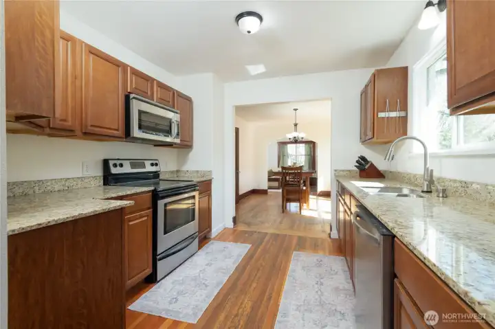 View looking back into the dining room from the pantry area of the kitchen.