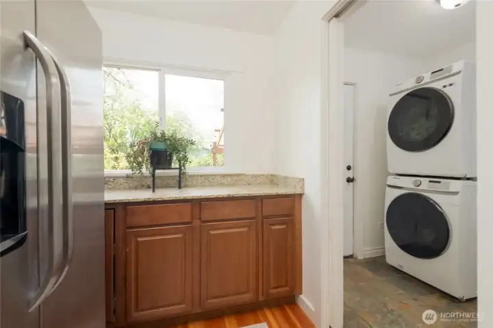 Pantry area off kitchen with pocket door to laundry room. Door to back patio from Laundry room,