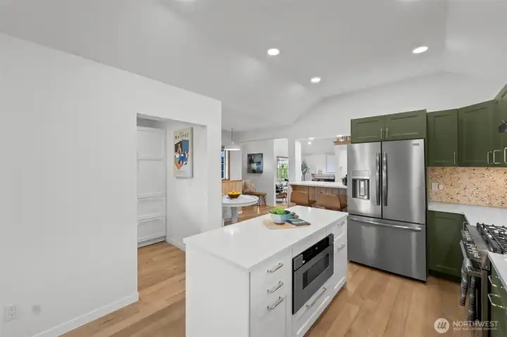 View of the beautiful kitchen and the entry way to the butlers pantry on the left