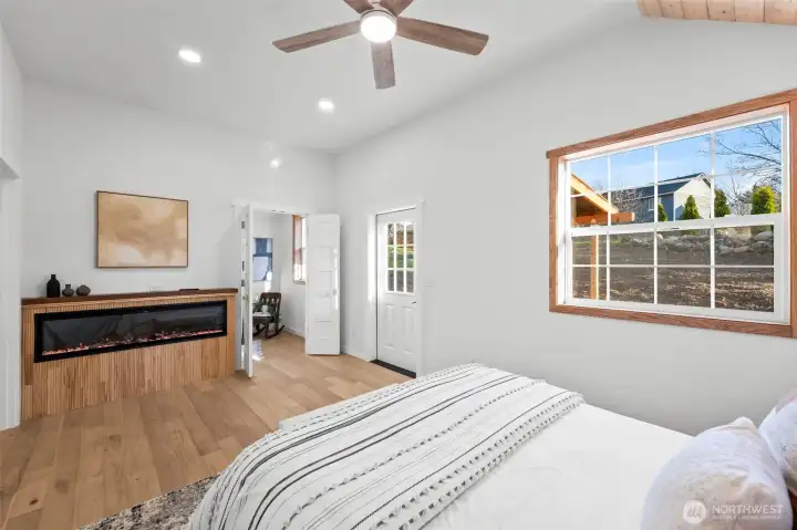 Primary bedroom, looking out to the flex room & the door that leads to your own private patio