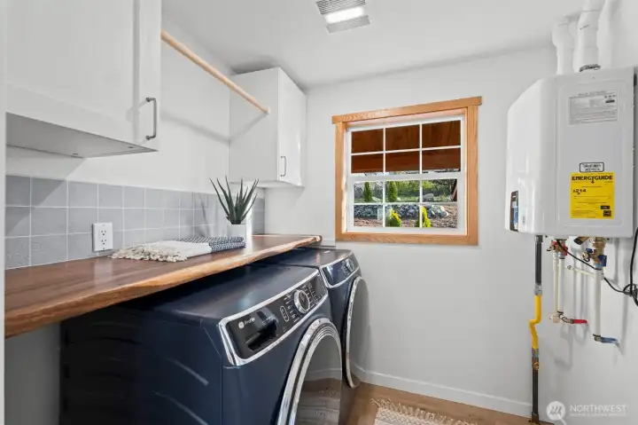 Washer & Dryer included in the sale! And guess who doesn't have to limit their shower usage?! ... YOU!! On demand water heater!!