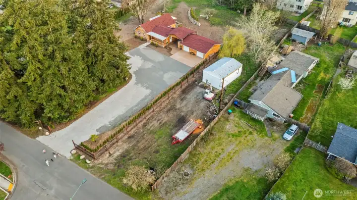 Adjoining lot to the right is available for sale as well and includes the shop. 1.57 acre total with both lots, inquire with listing agent for lot details