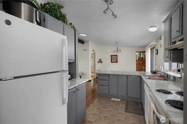 Move easily from the kitchen into the dining area with open sightlines and natural light.