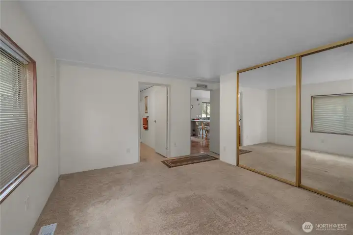 Primary BR - Bedroom offers generous floor space, mirrored closet doors, and a functional layout.