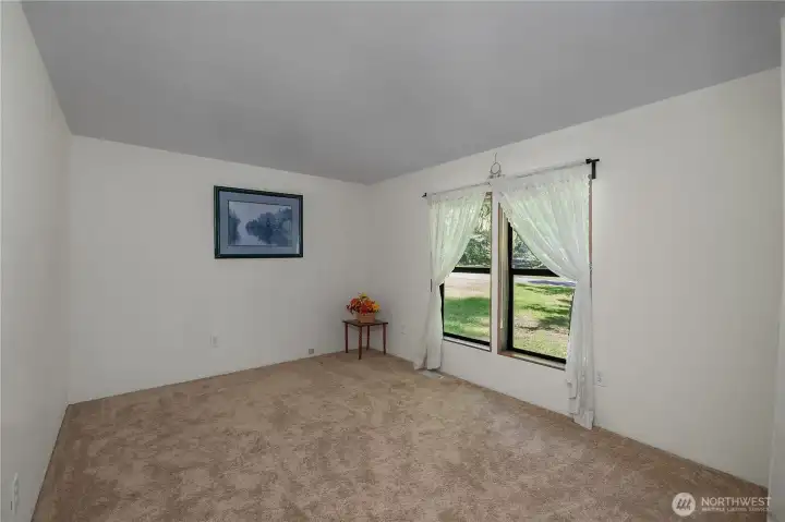 BR #2 - Settle into a comfortable second bedroom with soft carpeting, natural light, and a quiet outlook.