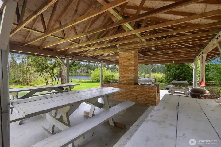 Community WF Park - Covered picnic space with tables, brick fireplace, and a beautiful view toward Lake McIntosh.