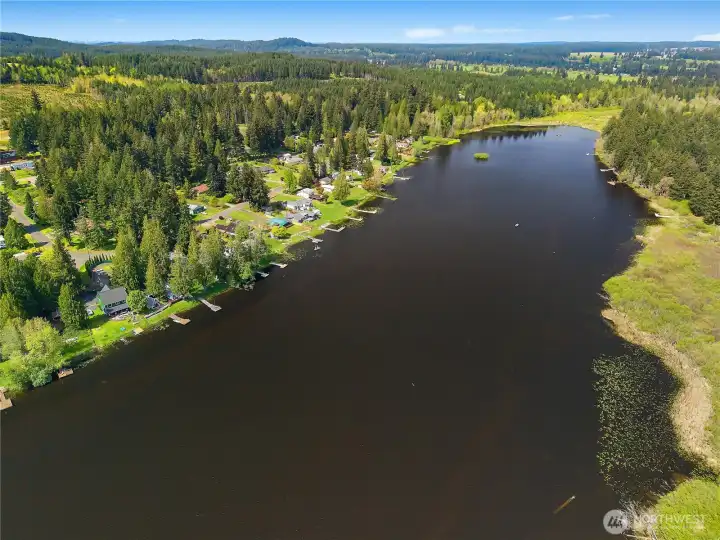 Explore McIntosh Lake, a well-known fishing lake surrounded by trees, docks, and quiet homes.