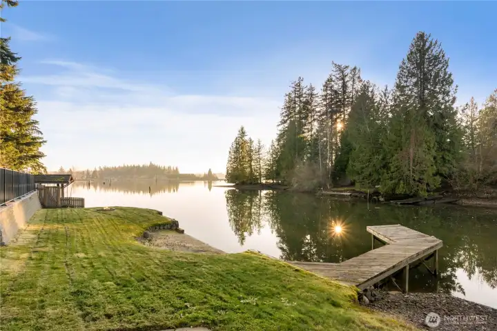 Nestled in a secluded cove, enjoy your own private boat launch, dock, and sandy beach swimming area