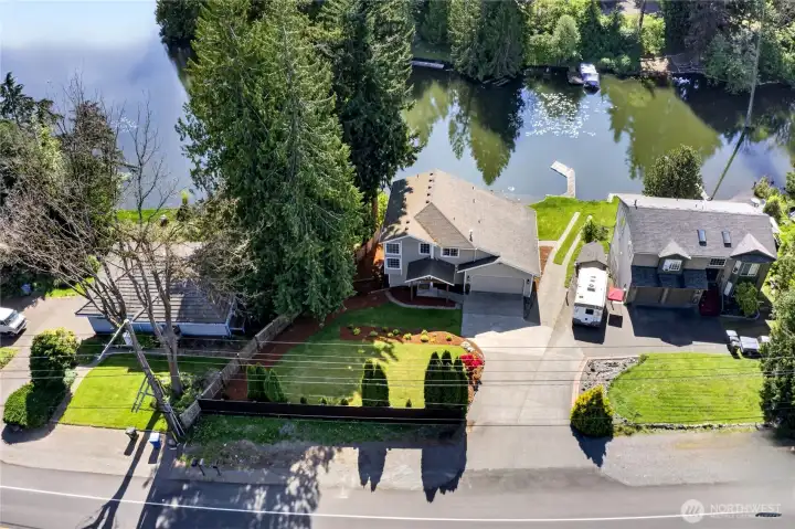 2 car garage plus extra parking in driveway and off street parking, hardiplank siding, mature landscaping, your own boat launch and fenced backyard