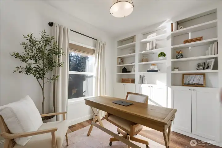 Main floor office with built ins, lake view and closet