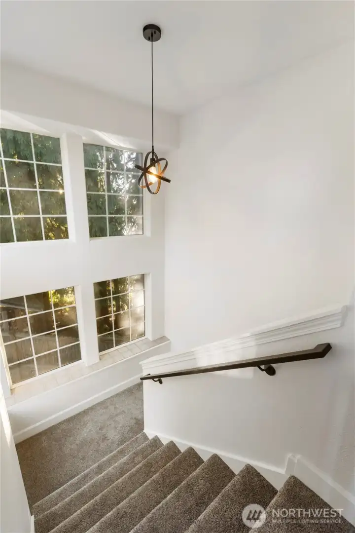 Light and bright stairs lead to lower level