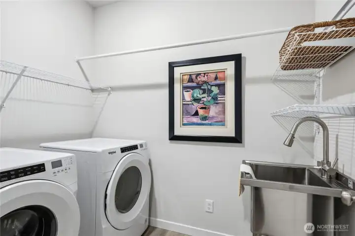 The utility room with washer and dryer.