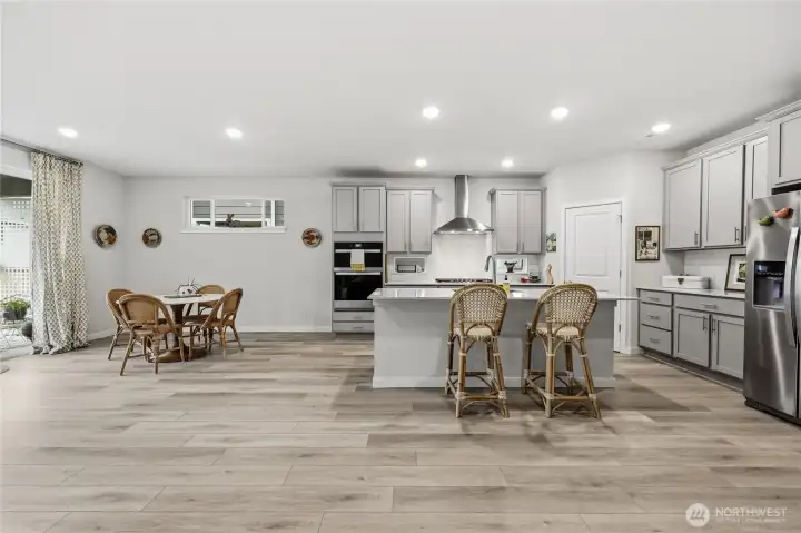 The dining area sits next to the kitchen and for casual dining take your meals at the stunning quartz counter!
