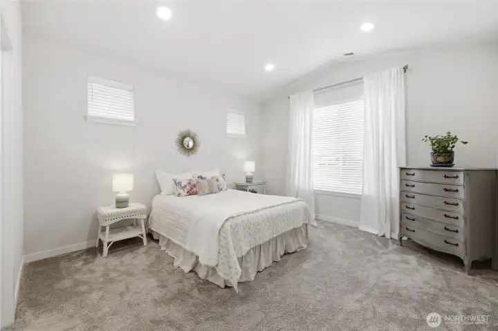 The spacious primary bedroom.