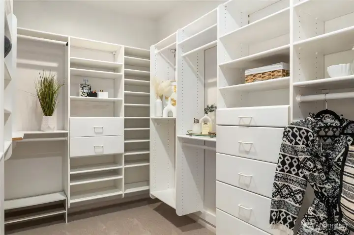 Primary walk-in closet. Primary walk-in closet.