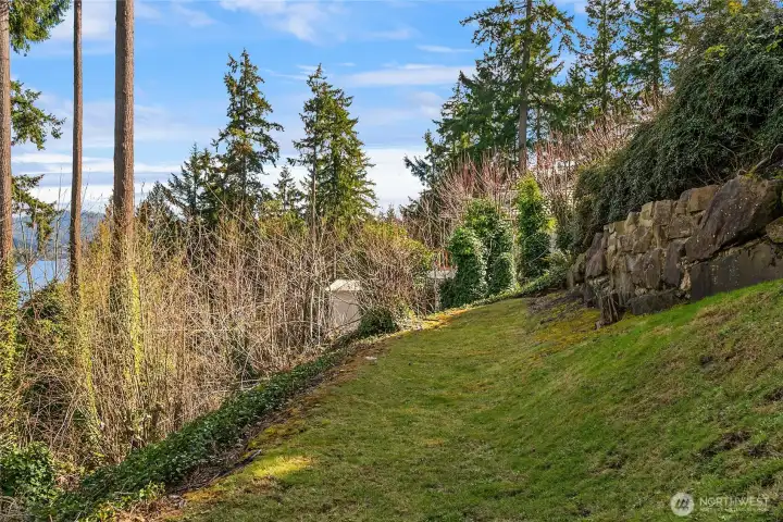Side yard with invisible fence system for pets. Side yard with invisible fence system for pets.