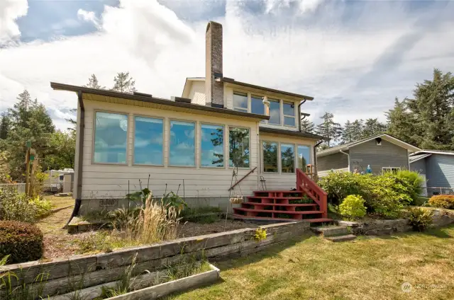 Expansive east facing windows provide a front row seat to wildlife estuary and Bay.