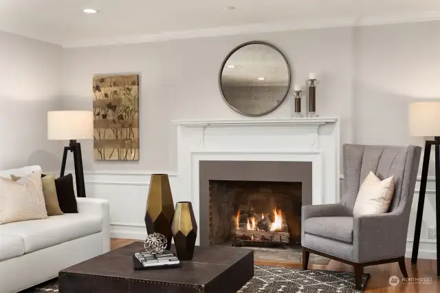 Gas fireplace with stone hearth, wood mantle and new quartz surround.