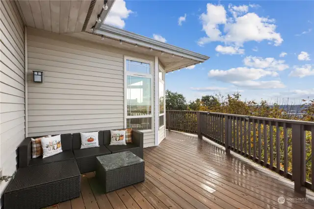 Access to deck from kitchen, living room, and primary room.