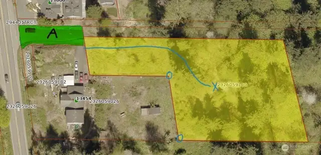 If making a site visit, park on the north side of Tract A. Follow the cleared path (blue line) up slope toward building site marked by blue X. Get your bearings by keeping track of the cyclone fence and their two corners.