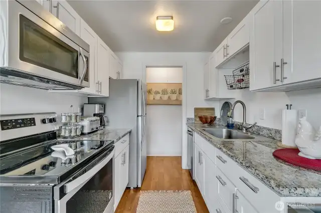 Remodeled kitchen with granite countertops, shaker cabinetry and stainless steel appliances - beautiful!