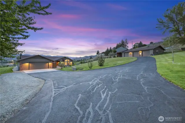 Photo capturing driveway to home + shop