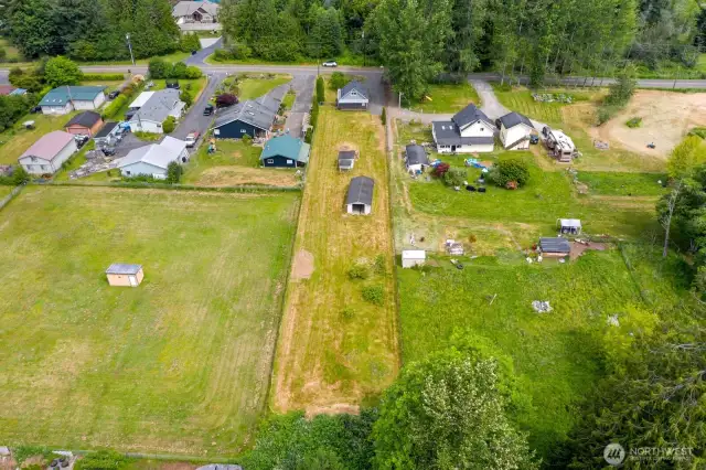 Aerial view of the property with shed & outbuilding