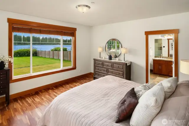Large Primary suite with view, access door to the deck, large walk-in closet and 5 piece primary bath.