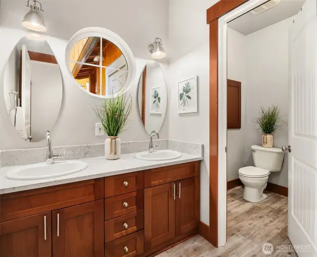 Full bathroom with double vanity.