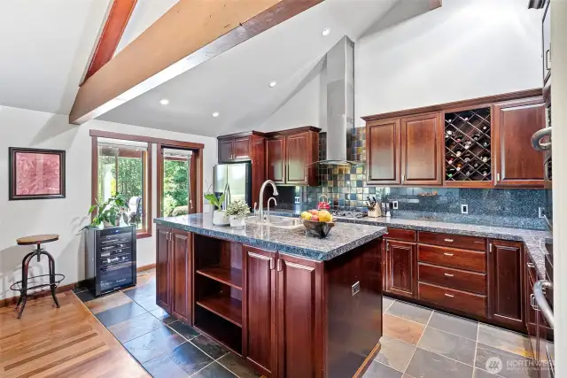 Gourmet kitchen w/ cherry cabinets. Enter the back patio from here