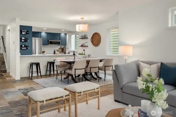 Timeless slate floors anchor the main living spaces, while new carpet, updated lighting,  fresh paint, and custom built-ins give the home a polished, turnkey feel.