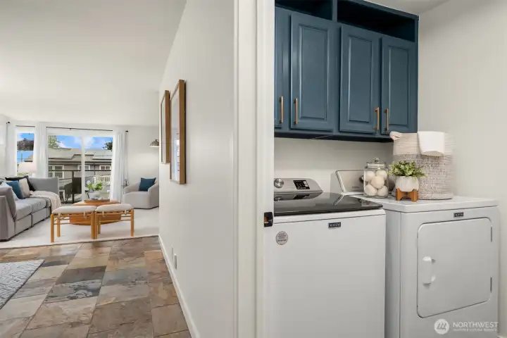 An oversized laundry room features full-size washer/dryer, pantry shelving, and space for a  deep freezer (included). Additional storage includes a walk-in entry closet and a 130-cu-ft  private storage room in the secure garage.