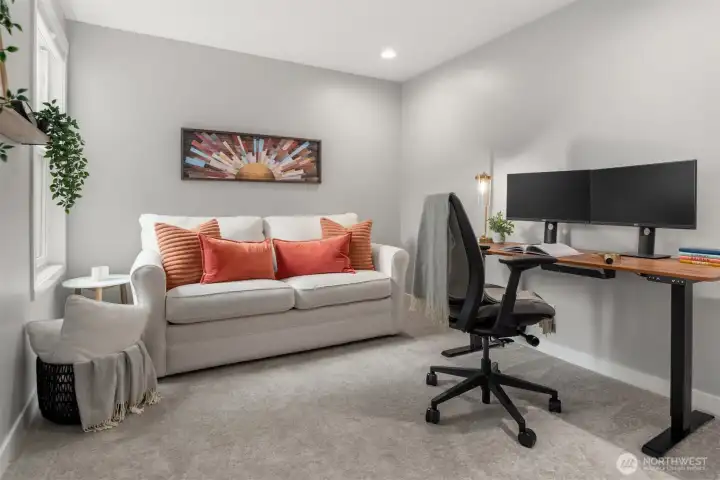 The second bedroom offers flexibility for guests, a home office, or creative use. The guest  bath continues the home’s cohesive, upscale updates with matching finishes and fixtures.