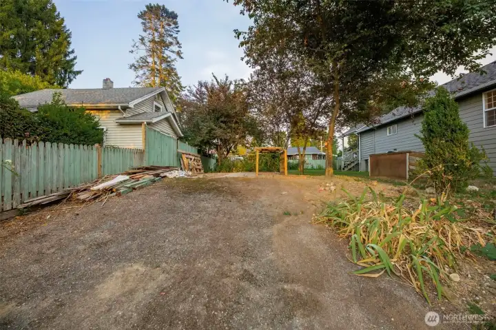 Paved access to concrete pad in back yard.