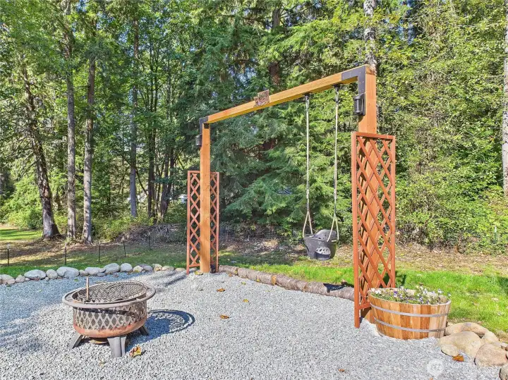 Wonderful Swing set and fire place.