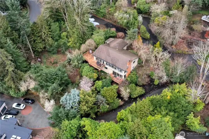View of back of home with upper and lower decks.