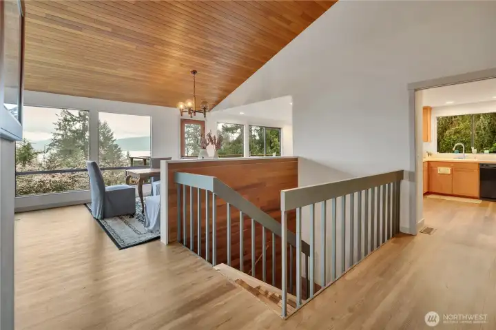 Wood arched ceiling across the living room and dining rooms.