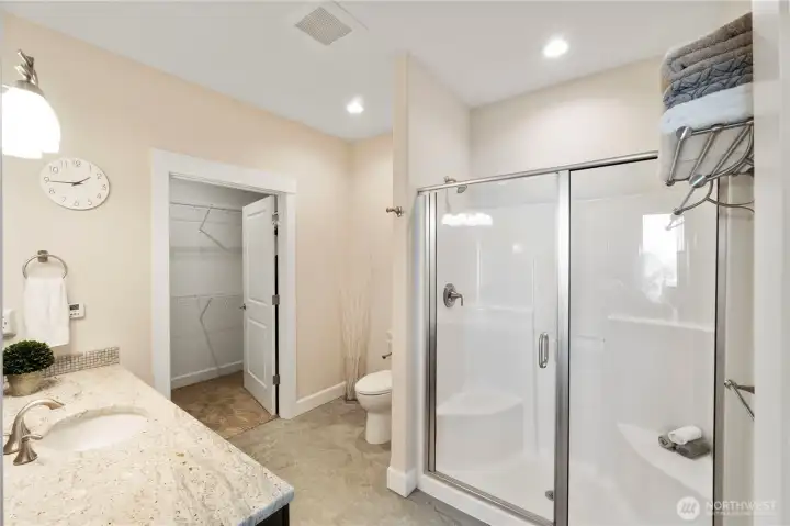 Ensuite bath with walk in shower and walk in closet