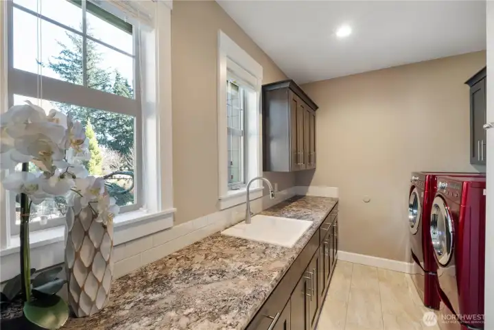 Large laundry with sink and storage
